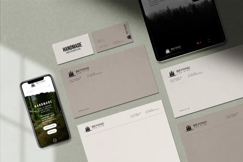 Brand identity applied across business cards, letterhead, phone, and tablet
